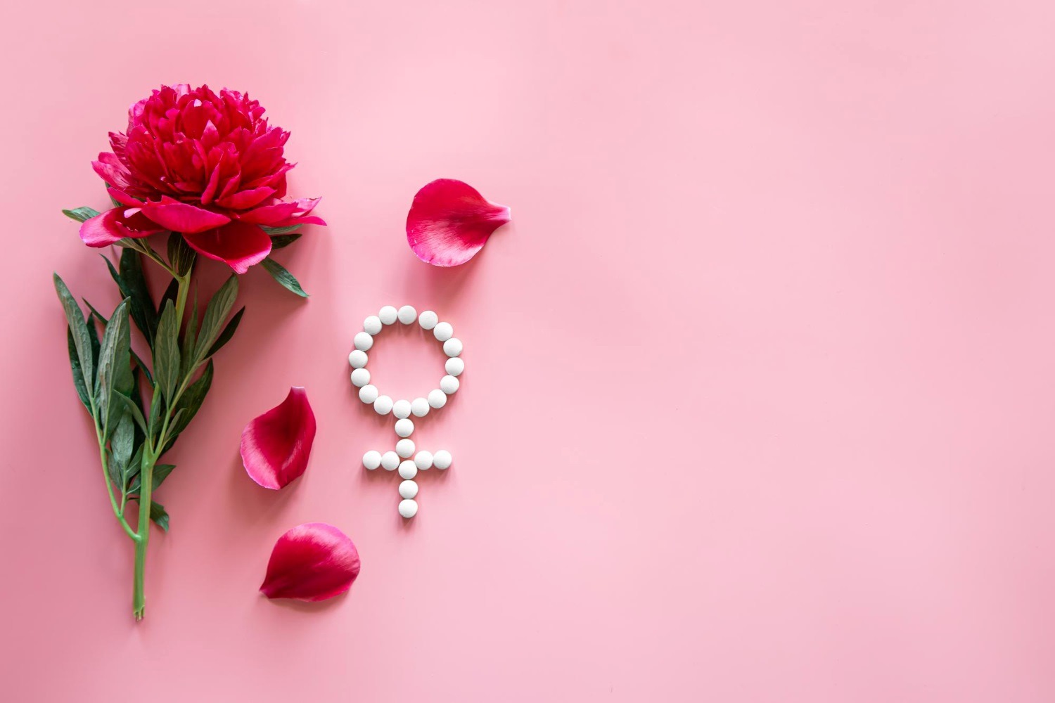 Photo: pvproductions via <a href="https://www.freepik.com/free-photo/gender-venus-symbol-made-pills-peony-flower-pink-background_28218998.htm#page=3&query=fertility&position=9&from_view=keyword&track=sph&uuid=22ed4e86-d71f-4fd6-86b2-7a01fac8765b" rel="noopener" target="_blank">Freepik</a>