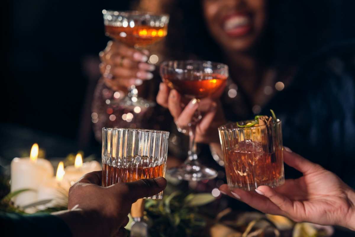 Photo: OurWhiskey Foundation via <a href="https://unsplash.com/photos/a-group-of-people-toasting-with-drinks-fO3-OMkc0mY" rel="noopener" target="_blank">Unsplash</a>